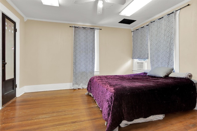 820 W Gandy St, Denison, TX 75020 - bedroom featuring wood finished floors, crown molding, baseboards, ceiling fan, and cooling unit