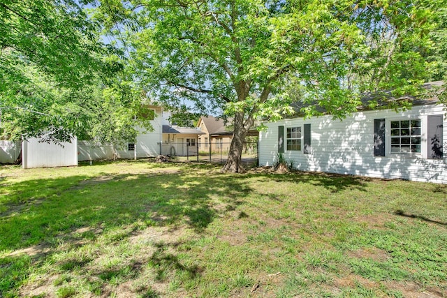 820 W Gandy St, Denison, TX 75020 - view of yard with an outbuilding and a storage shed