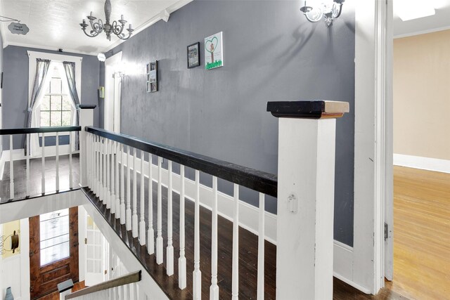 820 W Gandy St, Denison, TX 75020 - stairs featuring ornamental molding, wood finished floors, baseboards, and a chandelier