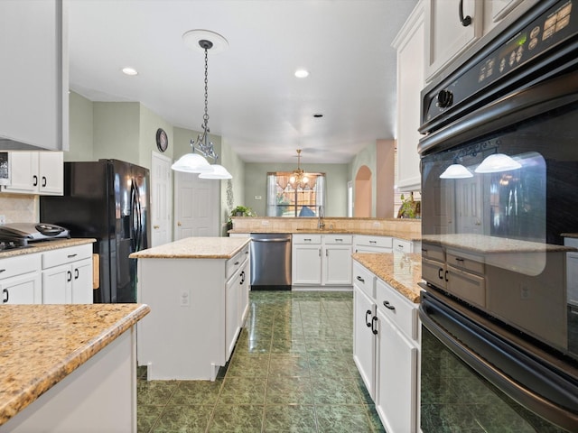 2105 Indian Trl, Rowlett, TX 75088 - kitchen with black appliances, decorative backsplash, a chandelier, a peninsula, and white cabinets