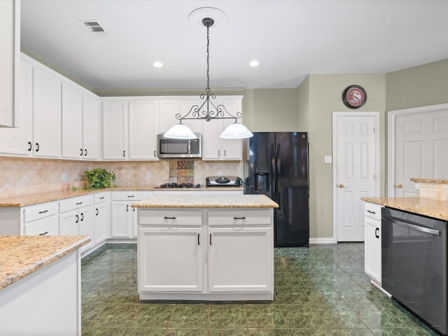 2105 Indian Trl, Rowlett, TX 75088 - kitchen with black appliances, decorative backsplash, white cabinetry, hanging light fixtures, and recessed lighting