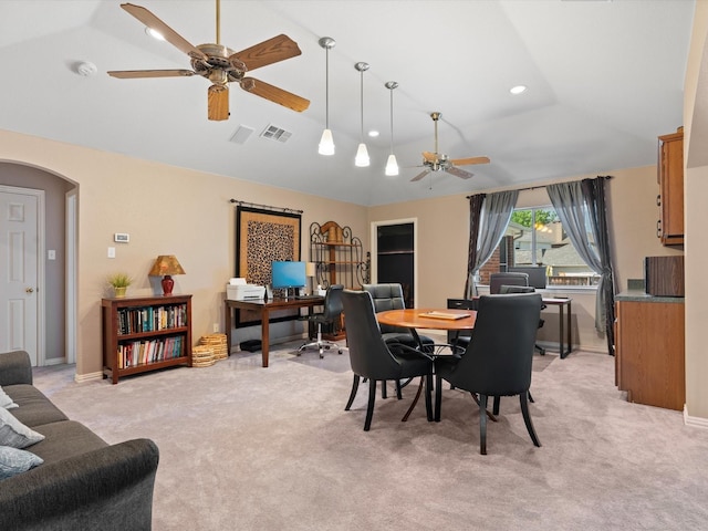 2105 Indian Trl, Rowlett, TX 75088 - dining space featuring a ceiling fan, lofted ceiling, an office area, arched walkways, and light colored carpet