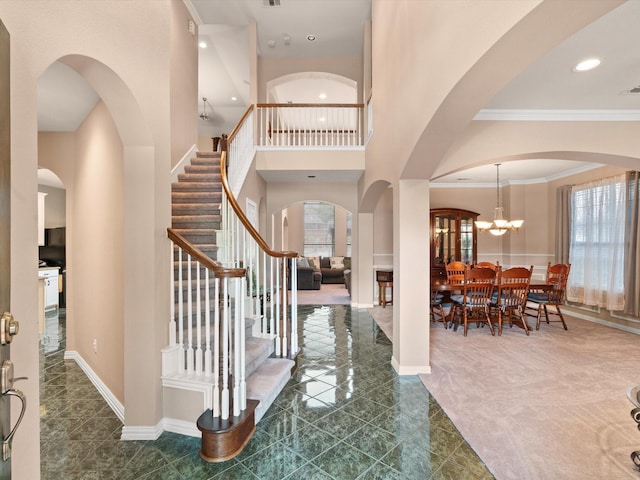 2105 Indian Trl, Rowlett, TX 75088 - entrance foyer featuring stairs, tile patterned floors, ornamental molding, a chandelier, and recessed lighting