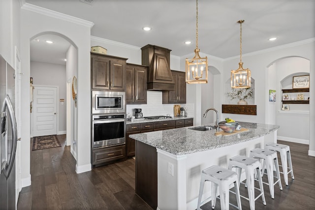 1037 Mickelson Dr, Granbury, TX 76048 - kitchen featuring stainless steel appliances, a sink, custom exhaust hood, baseboards, and light stone counters
