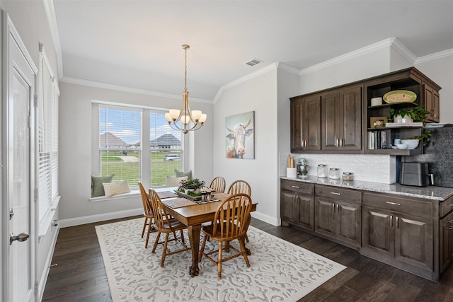 1037 Mickelson Dr, Granbury, TX 76048 - dining area featuring dark wood finished floors, a chandelier, crown molding, and baseboards