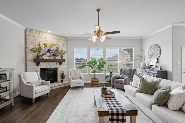 1037 Mickelson Dr, Granbury, TX 76048 - living room with ornamental molding, a ceiling fan, dark wood-style floors, a fireplace, and baseboards
