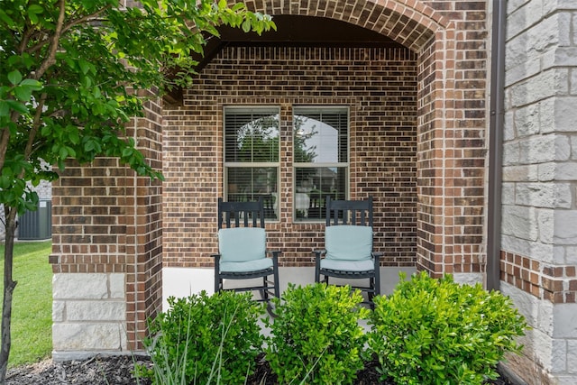 1037 Mickelson Dr, Granbury, TX 76048 - property entrance featuring brick siding and central air condition unit