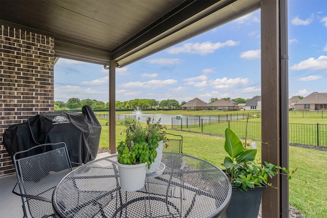 1037 Mickelson Dr, Granbury, TX 76048 - view of patio / terrace with a water view and outdoor dining area