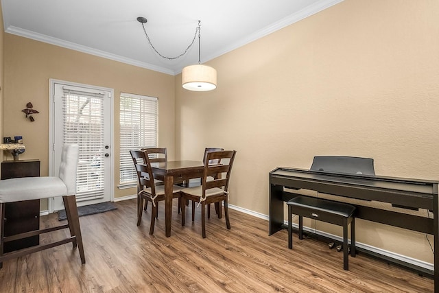 14333 Preston Rd Unit 2403, Dallas, TX 75254 - dining room featuring crown molding, wood finished floors, and baseboards