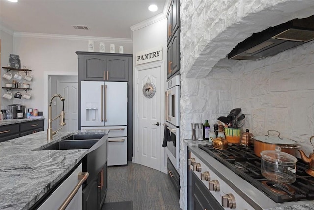 107 Falls Creek Ln, Gunter, TX 75058 - kitchen featuring white fridge with ice dispenser, gas cooktop, a sink, ornamental molding, and light stone countertops