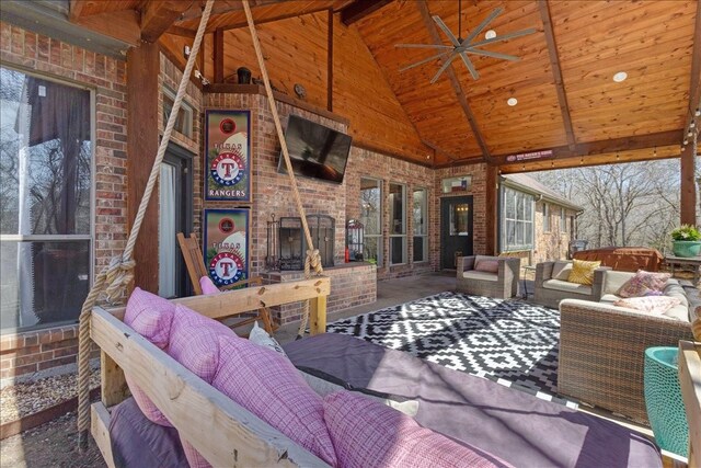 107 Falls Creek Ln, Gunter, TX 75058 - living room with high vaulted ceiling, an outdoor brick fireplace, wooden ceiling, beamed ceiling, and a ceiling fan