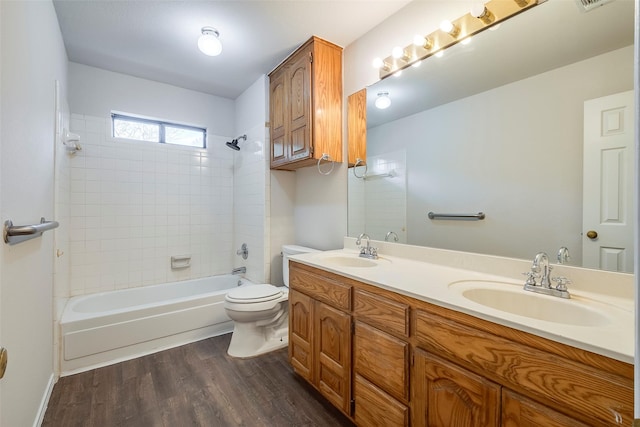 416 Birchwood Ln, Fort Worth, TX 76108 - bathroom featuring toilet, wood finished floors, double vanity, and shower / tub combination