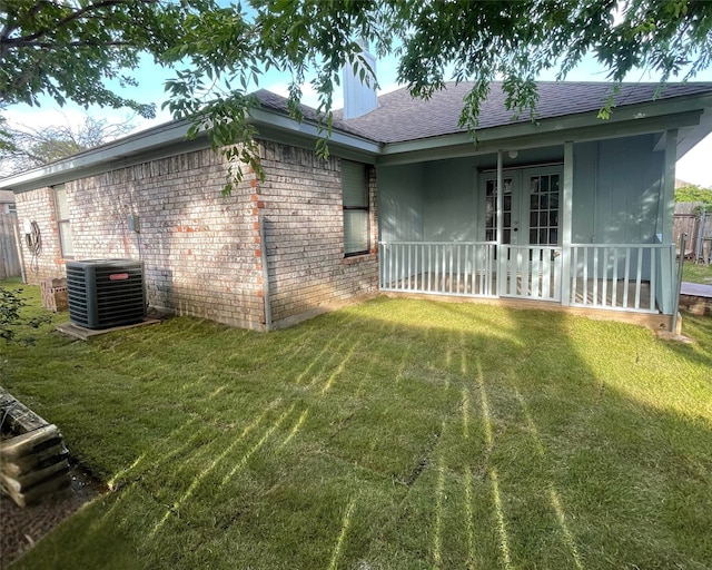 416 Birchwood Ln, Fort Worth, TX 76108 - rear view of house with central AC unit, french doors, roof with shingles, and brick siding