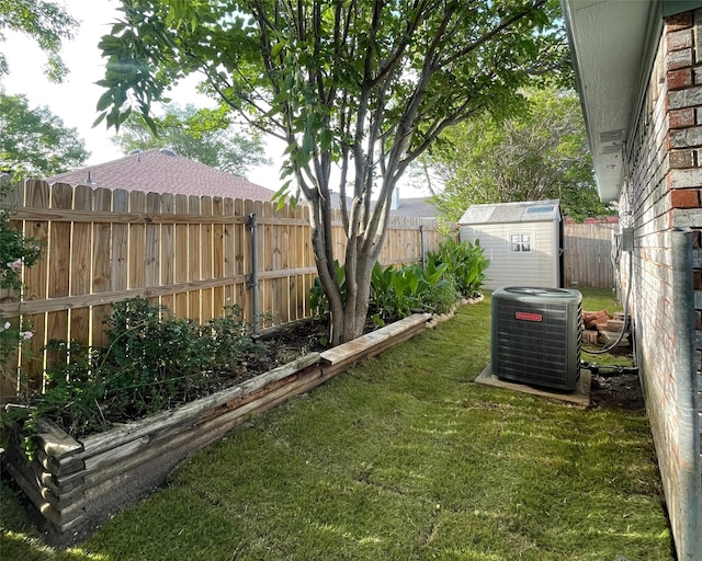 416 Birchwood Ln, Fort Worth, TX 76108 - view of yard featuring central AC unit, a storage unit, and an outbuilding