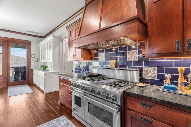 1206 Jc Maples Rd, Gunter, TX 75058 - kitchen with range with two ovens, backsplash, custom range hood, dark wood-style floors, and crown molding