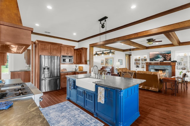 1206 Jc Maples Rd, Gunter, TX 75058 - kitchen with stainless steel fridge, a sink, blue cabinetry, a ceiling fan, and open floor plan