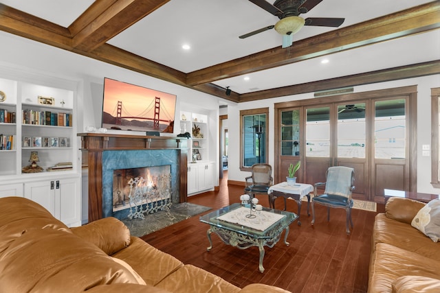 1206 Jc Maples Rd, Gunter, TX 75058 - living room with ceiling fan, a high end fireplace, beamed ceiling, wood finished floors, and built in shelves