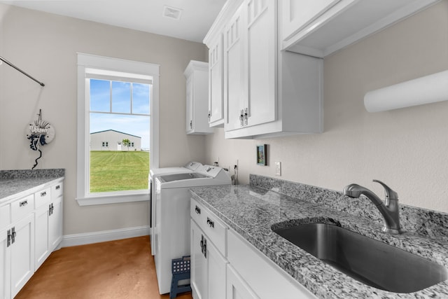 1206 Jc Maples Rd, Gunter, TX 75058 - washroom with cabinet space, washer and clothes dryer, and baseboards