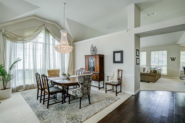 1016 S Hollow Dr, Southlake, TX 76092 - dining space featuring vaulted ceiling, a chandelier, hardwood / wood-style flooring, and baseboards