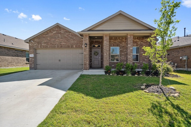 8580 Big Apple Dr, Fort Worth, TX 76179 - view of front of home with concrete driveway, an attached garage, a front lawn, and brick siding