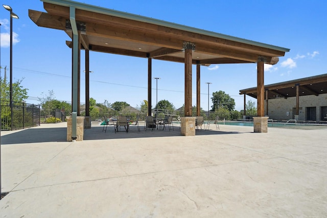 8580 Big Apple Dr, Fort Worth, TX 76179 - view of patio featuring a community pool and fence