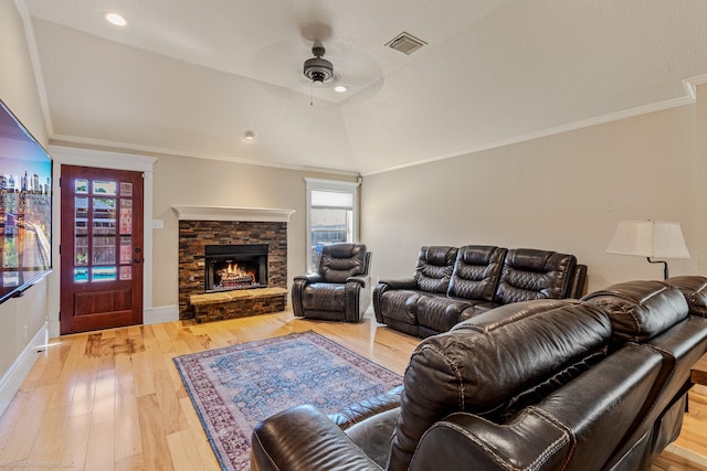 118 Lightning Trl, Forney, TX 75126 - living area featuring ceiling fan, light wood finished floors, ornamental molding, a stone fireplace, and baseboards