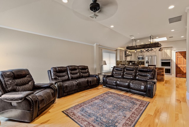 118 Lightning Trl, Forney, TX 75126 - living area with ceiling fan, vaulted ceiling, light wood finished floors, recessed lighting, and ornamental molding