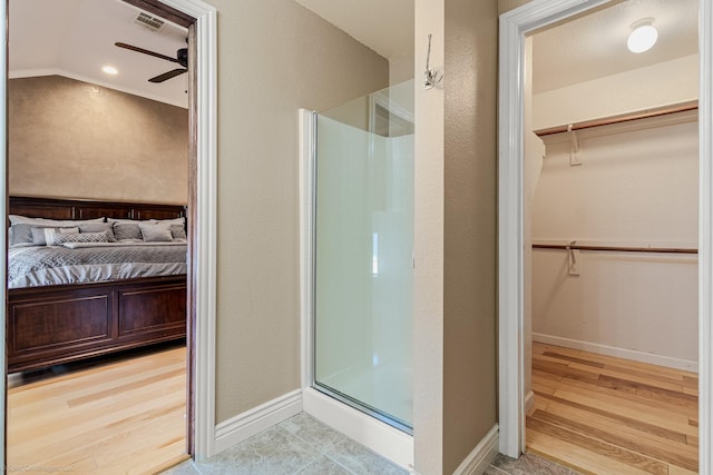 118 Lightning Trl, Forney, TX 75126 - ensuite bathroom with a shower stall, ceiling fan, wood finished floors, and baseboards