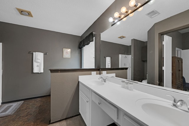 full bath with walk in shower and double vanity
