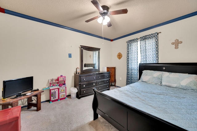 bedroom featuring light colored carpet, ornamental molding, a textured ceiling, and ceiling fan