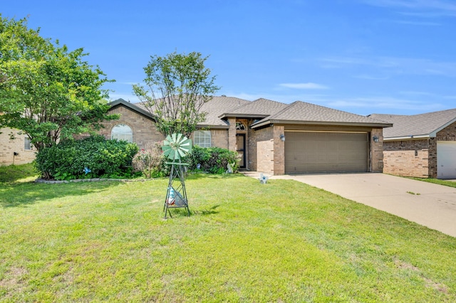 view of front facade with an attached garage, brick siding, a front yard, and driveway
