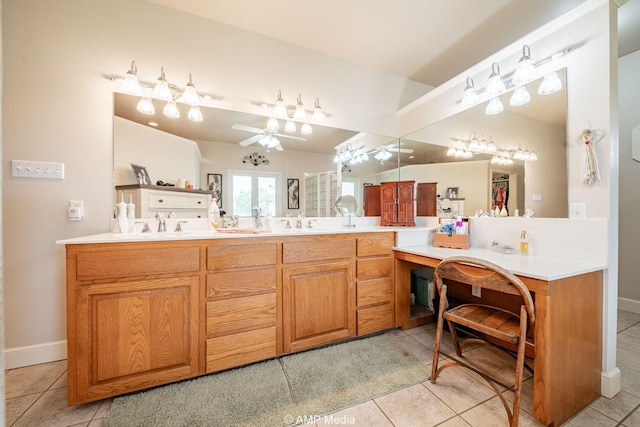 1302 County Road 142, Ovalo, TX 79541 - bathroom featuring a ceiling fan, tile patterned flooring, double vanity, and baseboards