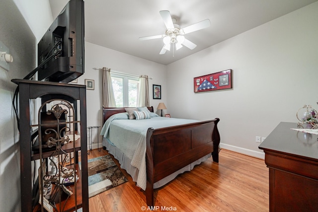 1302 County Road 142, Ovalo, TX 79541 - bedroom with baseboards, wood finished floors, and a ceiling fan
