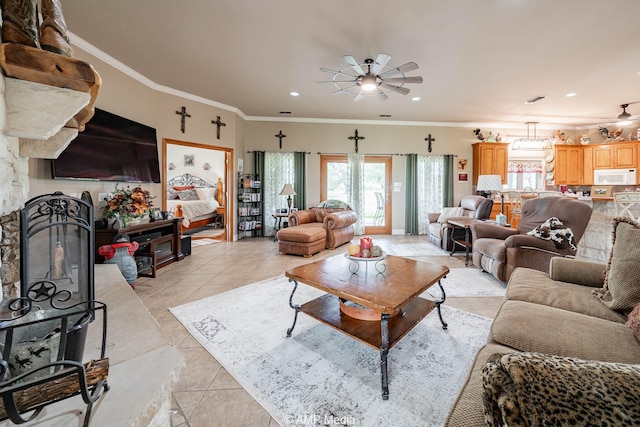1302 County Road 142, Ovalo, TX 79541 - living room with a ceiling fan, light tile patterned flooring, crown molding, and recessed lighting