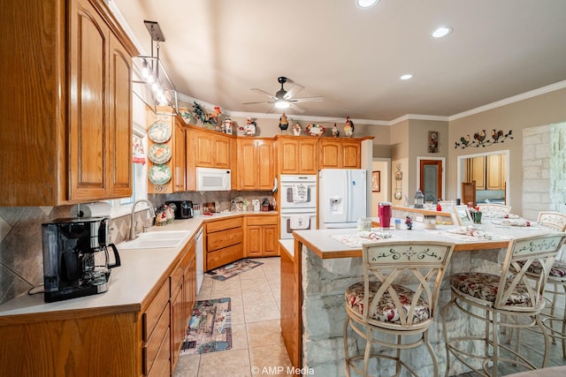 1302 County Road 142, Ovalo, TX 79541 - kitchen with a sink, white appliances, light countertops, backsplash, and a center island