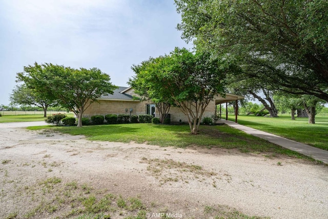 1302 County Road 142, Ovalo, TX 79541 - view of front of property with a front lawn, stone siding, and driveway