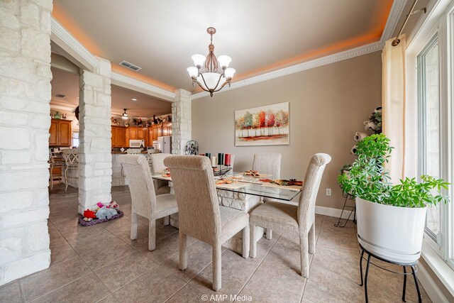 1302 County Road 142, Ovalo, TX 79541 - dining space featuring ornate columns, ornamental molding, a chandelier, light tile patterned floors, and baseboards