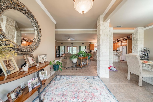 1302 County Road 142, Ovalo, TX 79541 - foyer with ornate columns, ornamental molding, a ceiling fan, and light tile patterned flooring