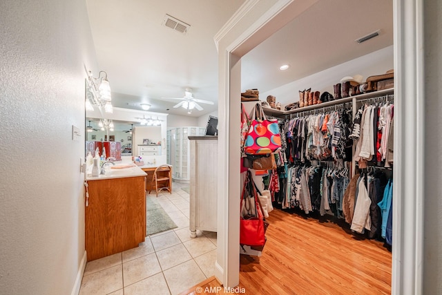 1302 County Road 142, Ovalo, TX 79541 - walk in closet with ceiling fan and light tile patterned floors