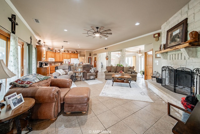 1302 County Road 142, Ovalo, TX 79541 - living area with crown molding, light tile patterned floors, ceiling fan, recessed lighting, and a fireplace