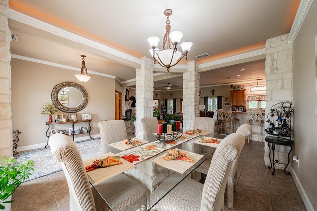 1302 County Road 142, Ovalo, TX 79541 - tiled dining space with decorative columns, crown molding, baseboards, and a chandelier