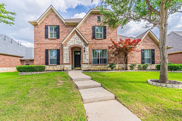 15097 Blakehill Dr, Frisco, TX 75035 - view of front of home with brick siding, a front lawn, and a shingled roof