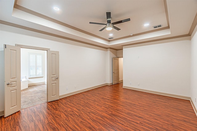 15097 Blakehill Dr, Frisco, TX 75035 - empty room with a tray ceiling, ornamental molding, wood finished floors, ceiling fan, and recessed lighting