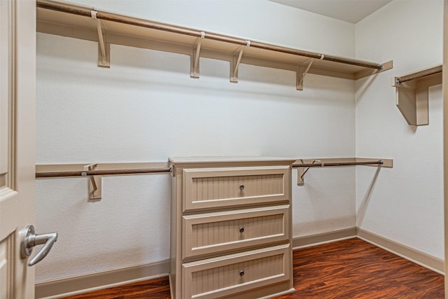 15097 Blakehill Dr, Frisco, TX 75035 - walk in closet with dark wood-style flooring