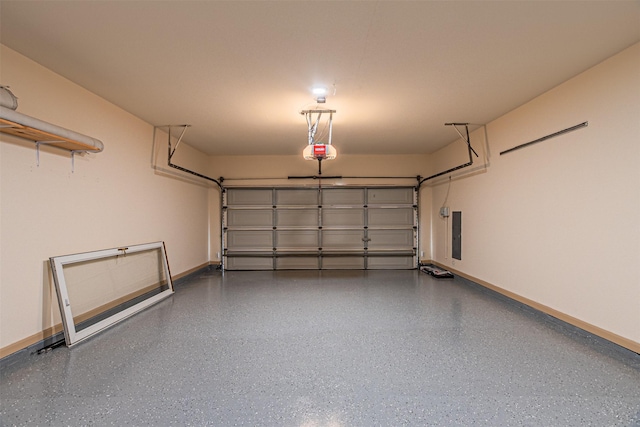 15097 Blakehill Dr, Frisco, TX 75035 - garage featuring baseboards, a garage door opener, and electric panel