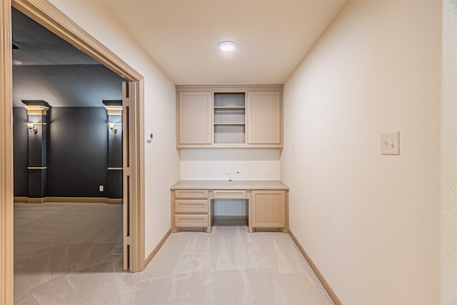 15097 Blakehill Dr, Frisco, TX 75035 - interior space featuring built in desk, light colored carpet, and baseboards