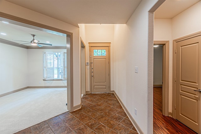 15097 Blakehill Dr, Frisco, TX 75035 - foyer with baseboards, a ceiling fan, and dark colored carpet