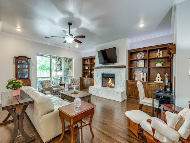 1141 Saint Peter Ln, Prosper, TX 75078 - living room featuring ceiling fan, a fireplace, ornamental molding, wood finished floors, and recessed lighting