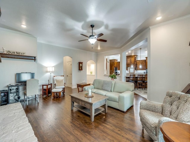 1141 Saint Peter Ln, Prosper, TX 75078 - living room with arched walkways, crown molding, ceiling fan, wood finished floors, and recessed lighting