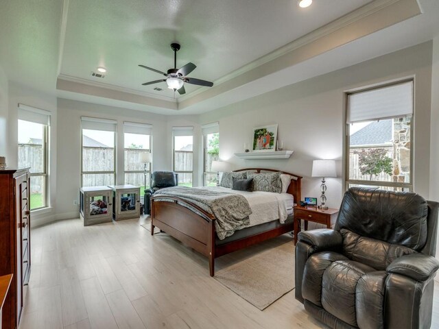 1141 Saint Peter Ln, Prosper, TX 75078 - bedroom featuring a raised ceiling, crown molding, multiple windows, light wood-type flooring, and recessed lighting